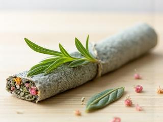 Garden Sage and Floral Smudge Stick on a light background