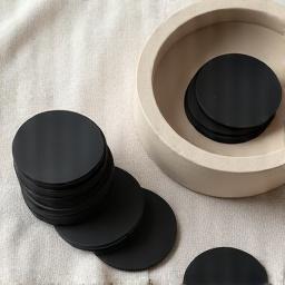 Assortment of charcoal discs and a simple ceramic censer for burning resin
