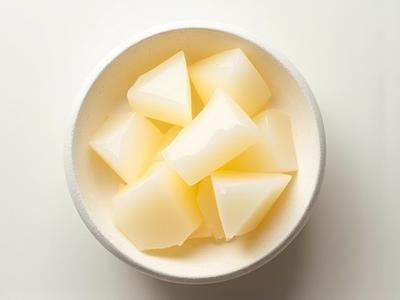 Translucent white Copal resin chunks in a stone bowl